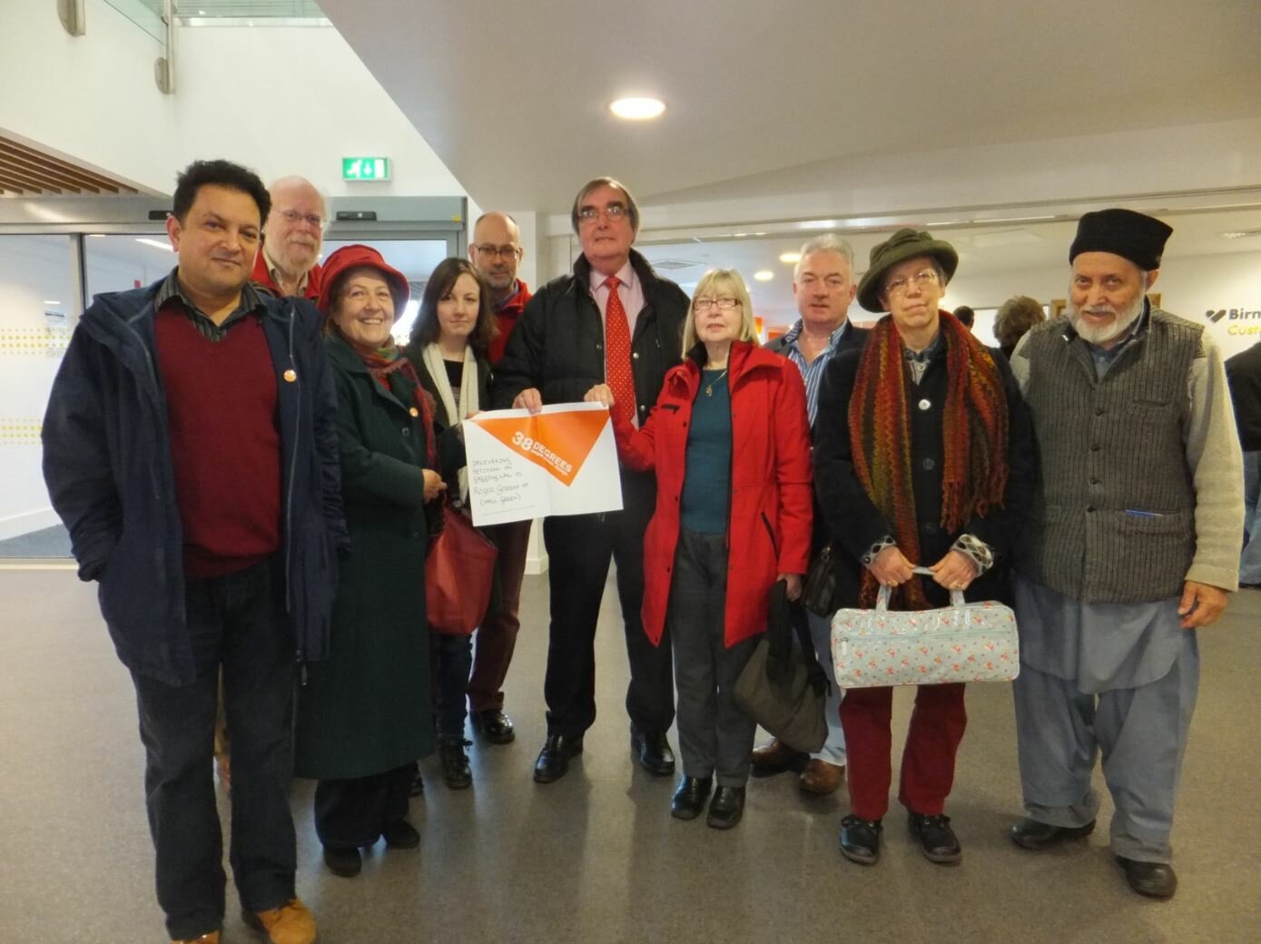 Supporters of the 38 Degrees campaign group presenting a petition to Roger opposing the Lobbying Bill. Birmingham, 3 January 2014.